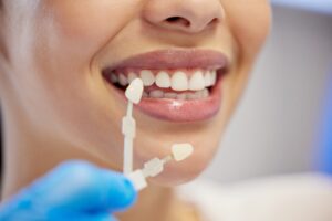 Dentist performing a professional teeth cleaning procedure, using advanced tools to enhance oral health, prepare for veneers, and relieve toothache discomfort